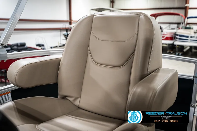 Slide: The Image of 2024 SunChaser 16 Vista boat seat in a showroom, featuring beige upholstery. - 33