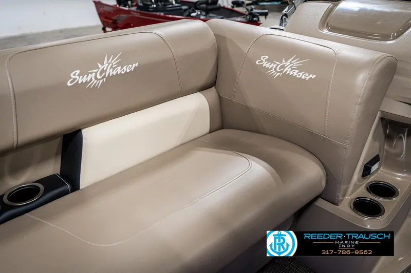 Slide: The Image of 2024 SunChaser 16 Vista boat interior with beige seating and cup holders. - 34