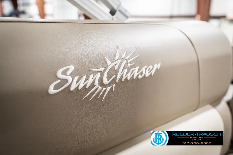 Slide: The Image of 2024 SunChaser 16 Vista boat interior with logo detail, Reeder-Trausch branding visible. - 36