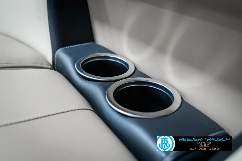 Slide: The Image of 2024 SunChaser 16 Vista boat interior with dual cup holders. - 39