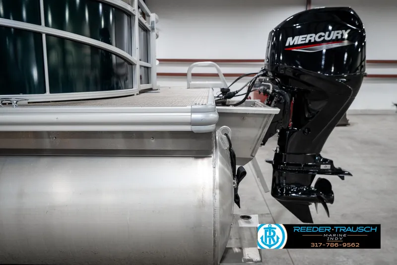 Slide: The Image of 2024 SunChaser 16 Vista pontoon boat with Mercury outboard motor in showroom. - 40