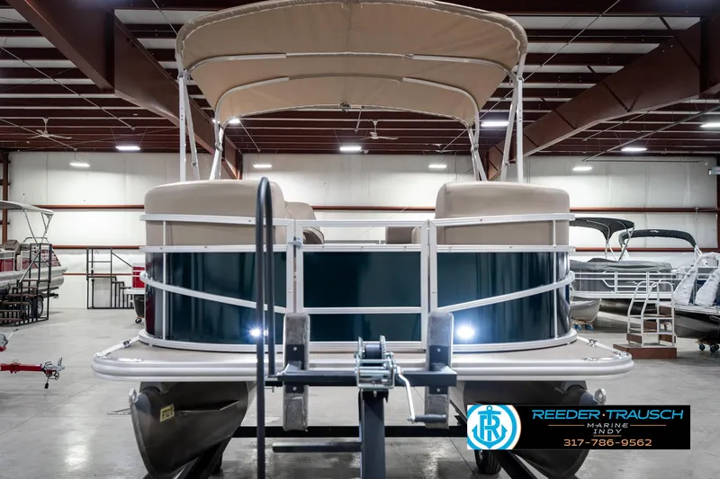 Slide: The Image of 2024 SunChaser 16 Vista pontoon boat in showroom, front view with canopy. - 5