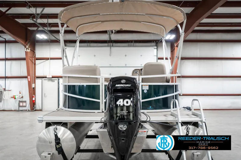 Slide: The Image of 2024 SunChaser 16 Vista pontoon boat with Mercury 40 engine in a warehouse setting. - 9