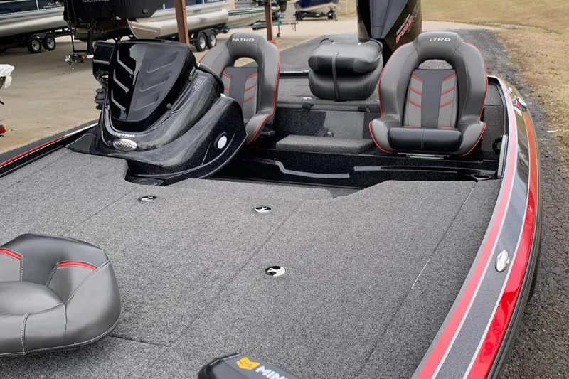 Slide: The Image of 2019 Nitro Z19 Pro boat interior with seating and carpeted deck. - 8