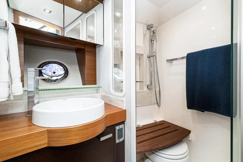 Slide: The Image of Luxurious bathroom in 2017 Tiara Yachts 44 Coupe, featuring modern sink and shower. - 14