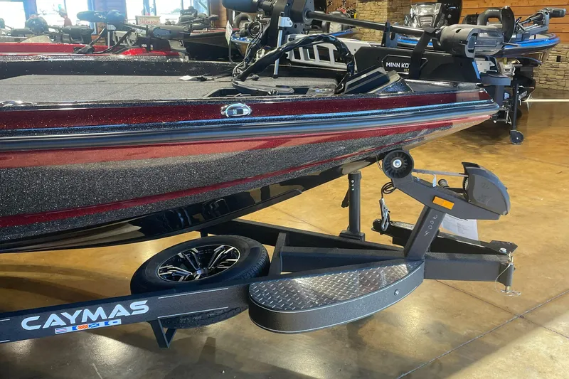 The Image of 2025 Caymas CX 18 Pro boat on trailer in showroom. - 1