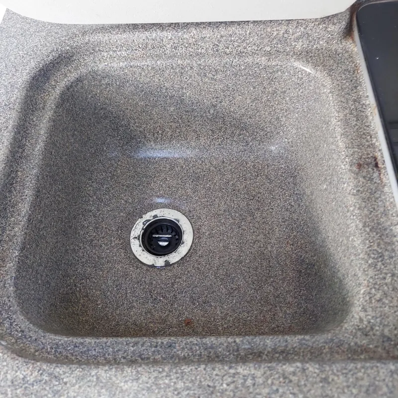 Slide: The Image of Gray granite sink in a 2000 Crownline 242 CR boat. - 14