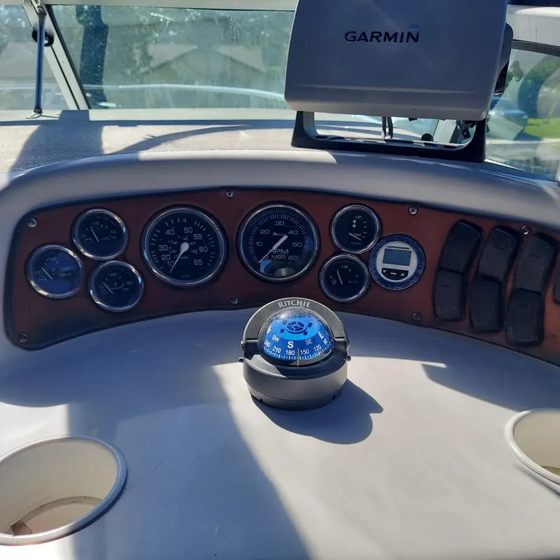 Slide: The Image of Dashboard of a 2000 Crownline 242 CR boat with Garmin navigation and compass. - 22