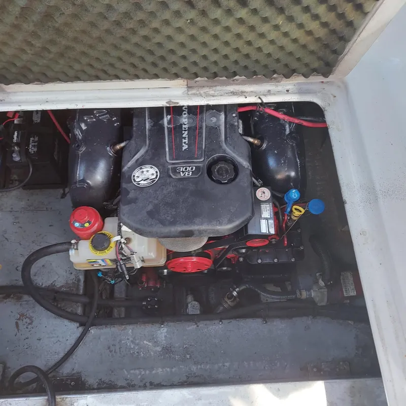 Slide: The Image of Engine compartment of a 2000 Crownline 242 CR boat, featuring a V8 engine. - 25