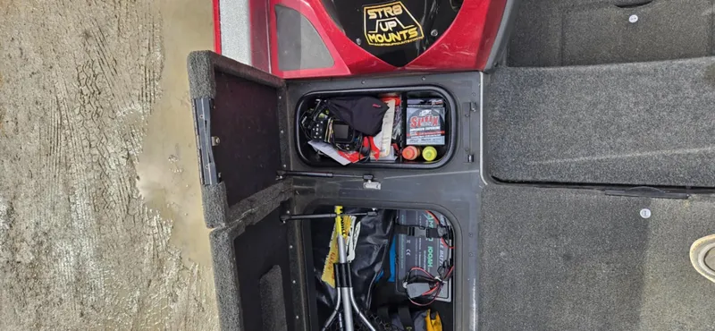 Slide: The Image of 2013 Skeeter ZX20 storage compartments with equipment and supplies. - 20