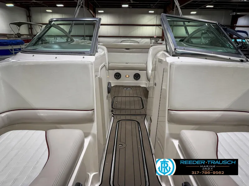 Slide: The Image of Interior view of a 2007 Bryant 240 boat with seating and dashboard. - 19