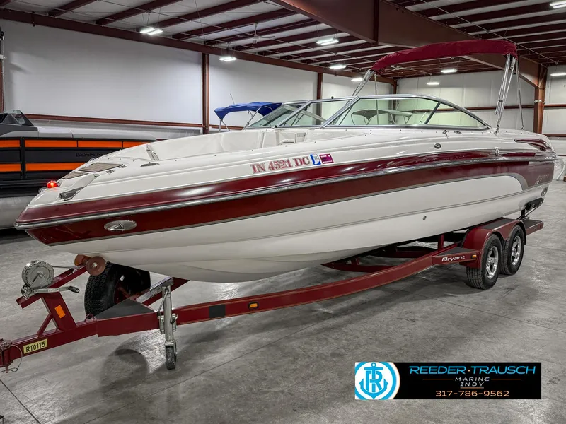Slide: The Image of 2007 Bryant 240 boat on trailer in indoor storage facility. - 2