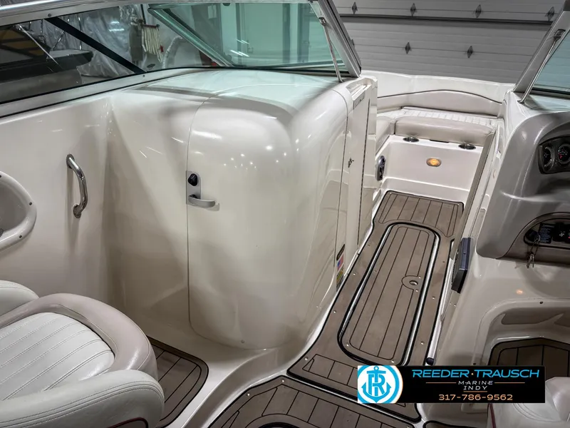 Slide: The Image of 2007 Bryant 240 boat interior with sleek design and wood-patterned flooring. - 25