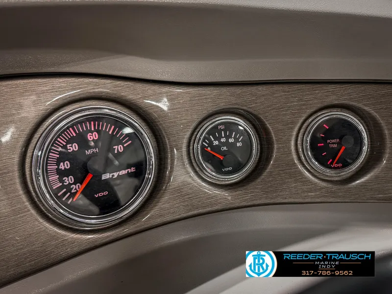 Slide: The Image of Dashboard gauges of a 2007 Bryant 240 boat, featuring speedometer and oil pressure indicators. - 39