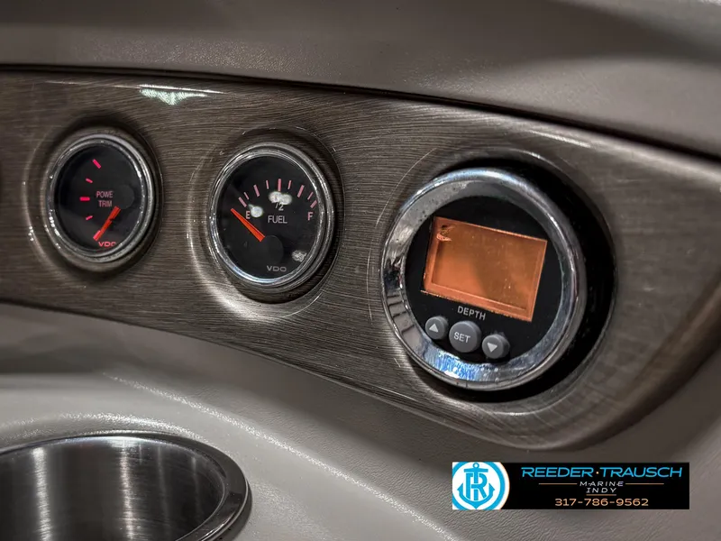 Slide: The Image of Dashboard of a 2007 Bryant 240 boat with gauges and depth meter. - 40