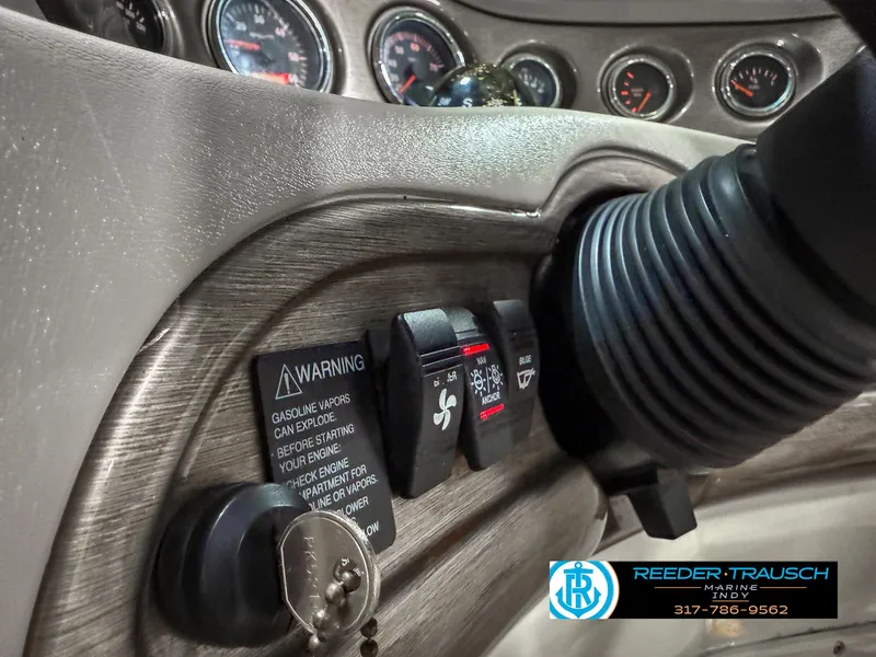 Slide: The Image of Dashboard of a 2007 Bryant 240 boat with ignition and warning labels. - 42