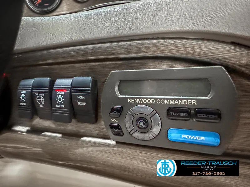 Slide: The Image of Control panel of a 2007 Bryant 240 boat with Kenwood Commander system. - 44
