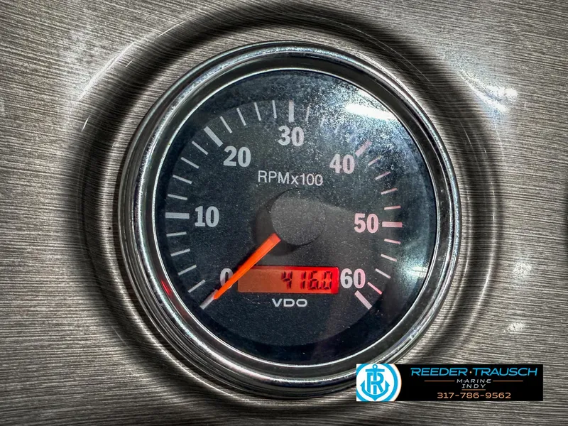 Slide: The Image of Tachometer displaying 4160 RPM on a 2007 Bryant 240 boat dashboard. - 46