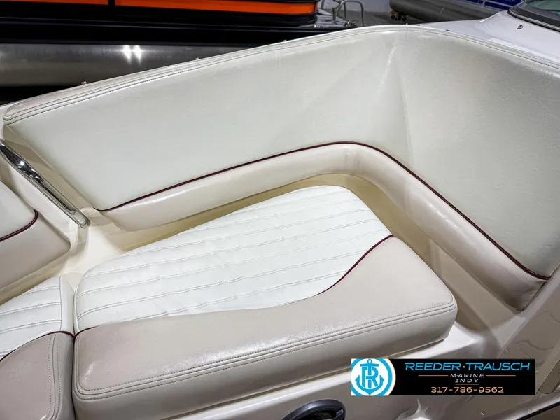 Slide: The Image of Cream and white boat seating in a 2007 Bryant 240, Reeder-Trausch Marine logo visible. - 49