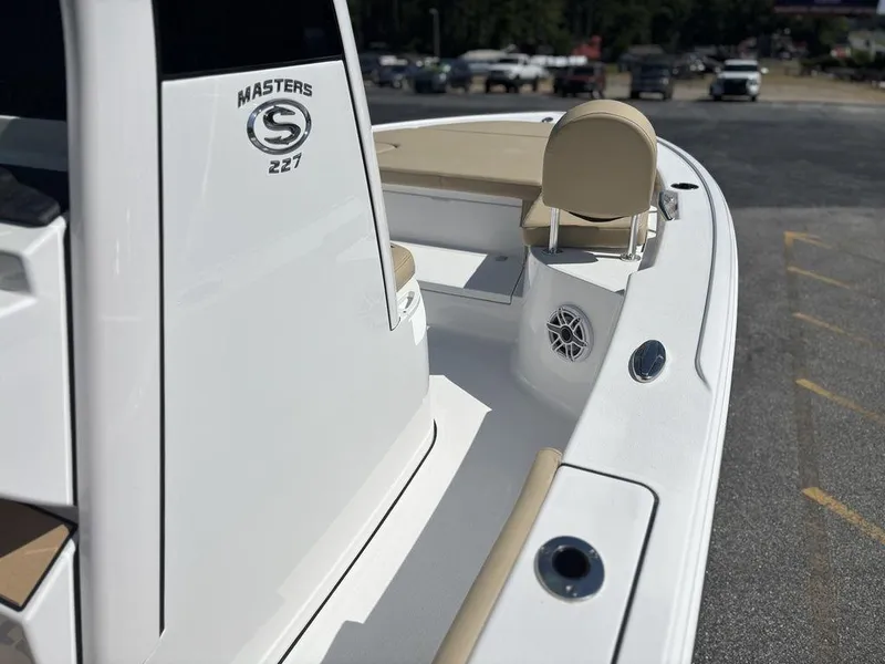 Slide: The Image of 2026 Sportsman Masters 227 Bay Boat dashboard with dual Garmin displays and compass. - 14