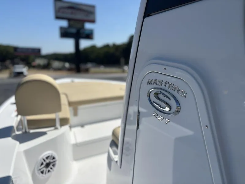 Slide: The Image of 2026 Sportsman Masters 227 Bay Boat interior with dual seats and steering console. - 18