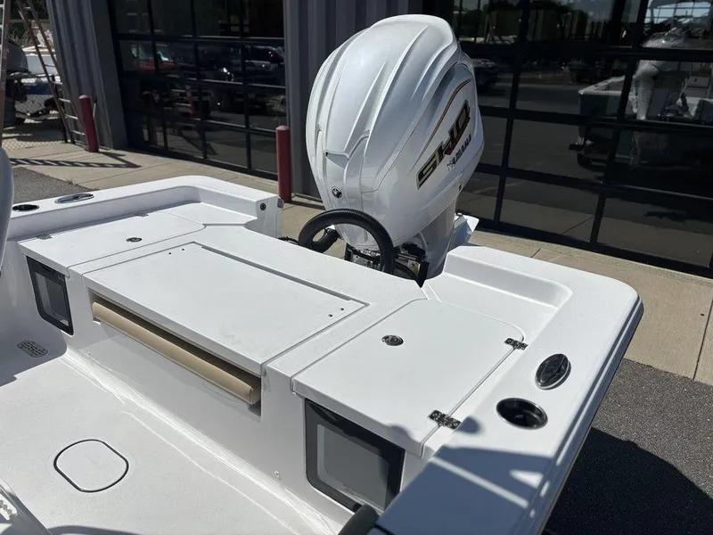 Slide: The Image of 2026 Sportsman Masters 227 Bay Boat console with steering wheel and controls. - 19