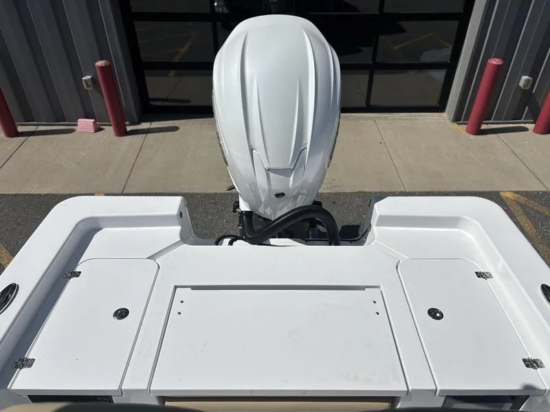 Slide: The Image of 2026 Sportsman Masters 227 Bay Boat with Yamaha engine and beige seating. - 22