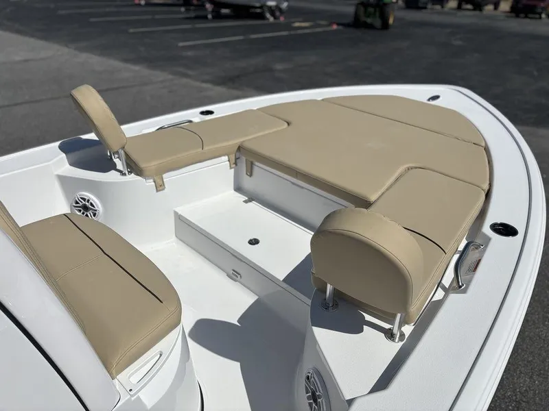 Slide: The Image of 2026 Sportsman Masters 227 Bay Boat with cushioned seating and storage compartments. - 25