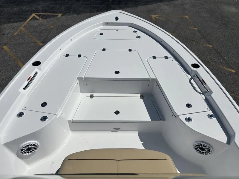 Slide: The Image of 2026 Sportsman Masters 227 Bay Boat deck with storage compartments and speakers. - 31