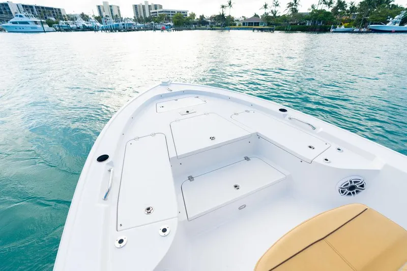 Slide: The Image of 2026 Sportsman Masters 227 Bay Boat with beige seating, docked at a marina. - 32