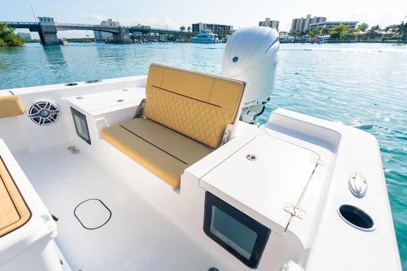 Slide: The Image of 2026 Sportsman Masters 227 Bay Boat, top view, beige seating, white hull. - 36