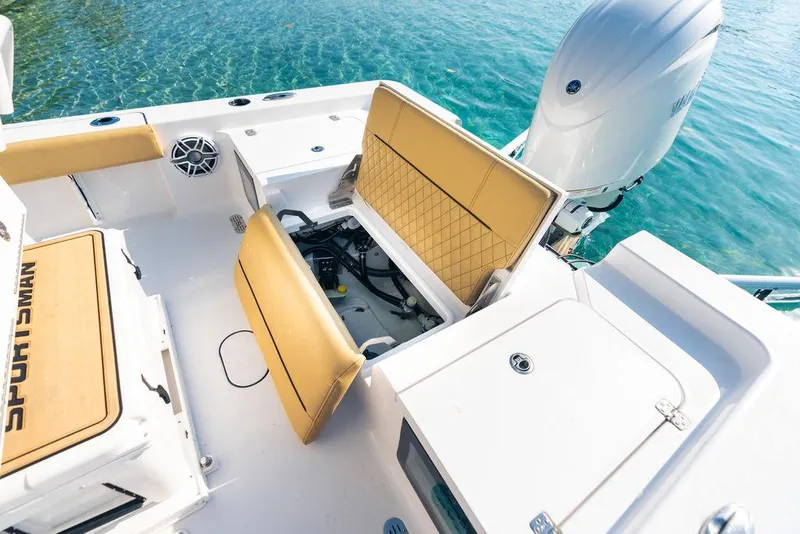 Slide: The Image of 2026 Sportsman Masters 227 Bay Boat battery compartment with wiring and electrical components. - 43