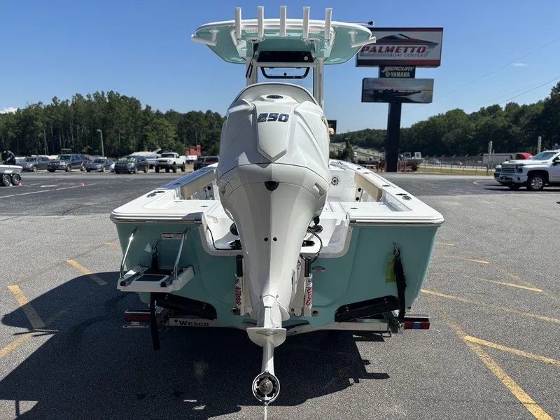 Slide: The Image of Man organizing fishing rods on 2026 Sportsman Masters 227 Bay Boat. - 44