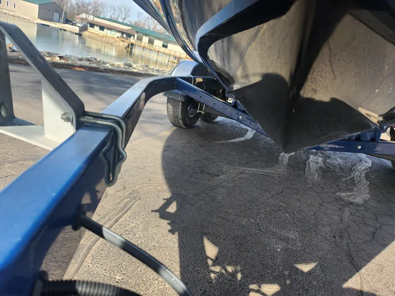 Slide: The Image of 2014 Sea Ray 210 SLX boat on trailer near waterfront. - 7