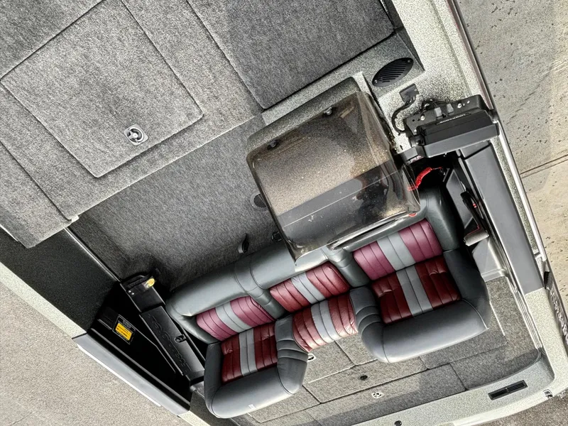 Slide: The Image of 1997 Ranger 481VS boat interior with red and gray seating and carpeted flooring. - 4