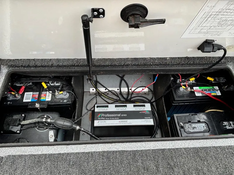 Slide: The Image of 1997 Ranger 481VS boat battery compartment with multiple batteries and wiring. - 8