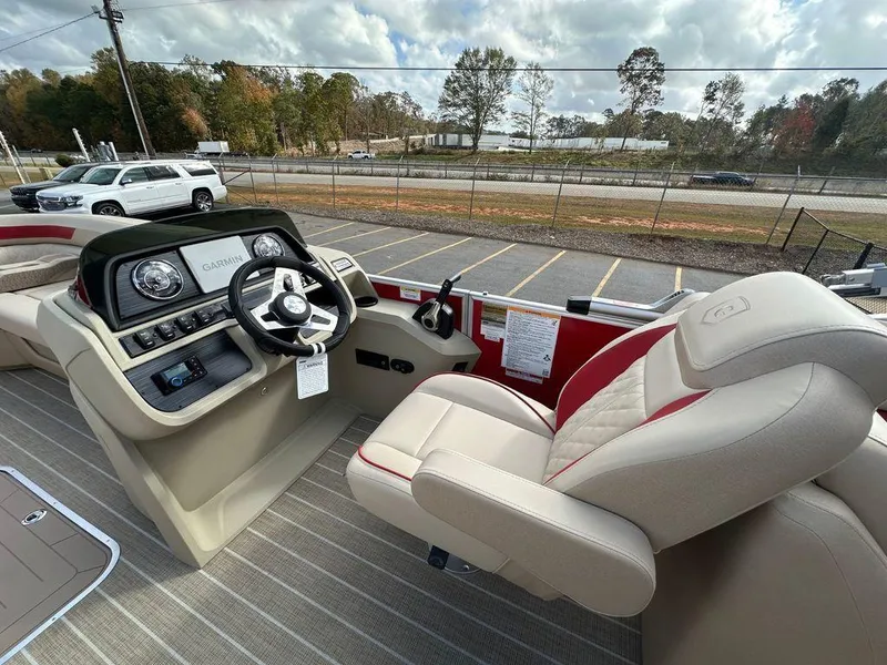 Slide: The Image of Interior view of 2025 Godfrey SWEETWATER 2286 SB boat with steering console and seating. - 9
