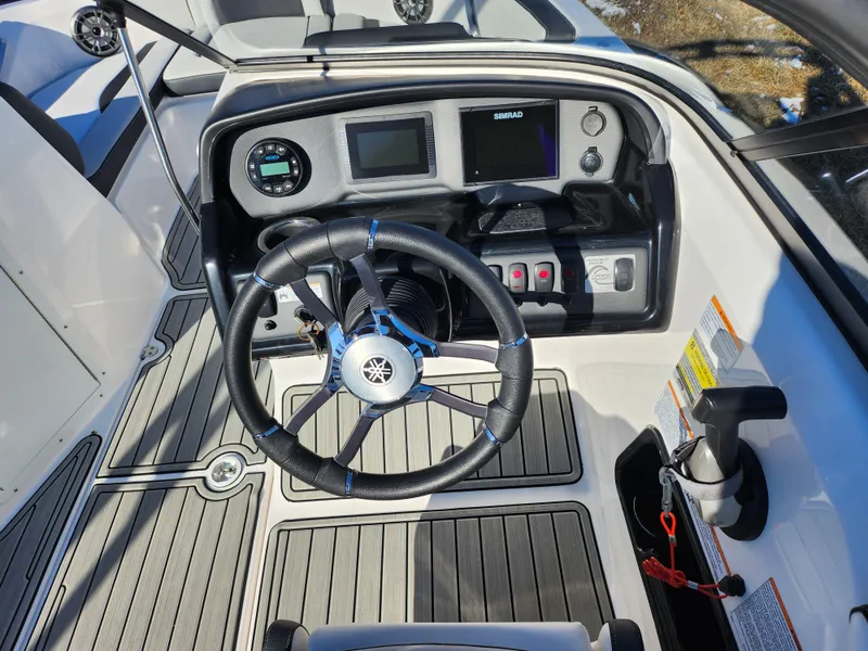 Slide: The Image of 2021 Yamaha Boats AR195 dashboard with steering wheel and control panel. - 11