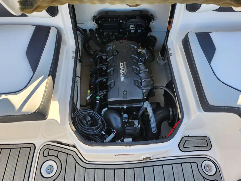 Slide: The Image of 2021 Yamaha Boats AR195 engine compartment with visible components and seating area. - 21
