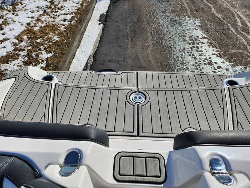 Slide: The Image of 2021 Yamaha Boats AR195 swim platform with sleek gray decking. - 22