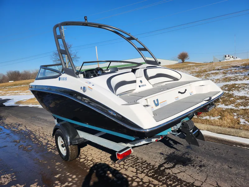 Slide: The Image of 2021 Yamaha Boats AR195 on trailer, sleek design, black and white color scheme. - 3
