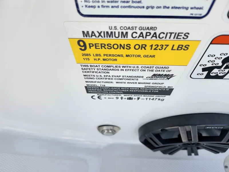 Slide: The Image of 2023 Tahoe T18 capacity label: 9 persons or 1237 lbs, 115 HP motor. - 13