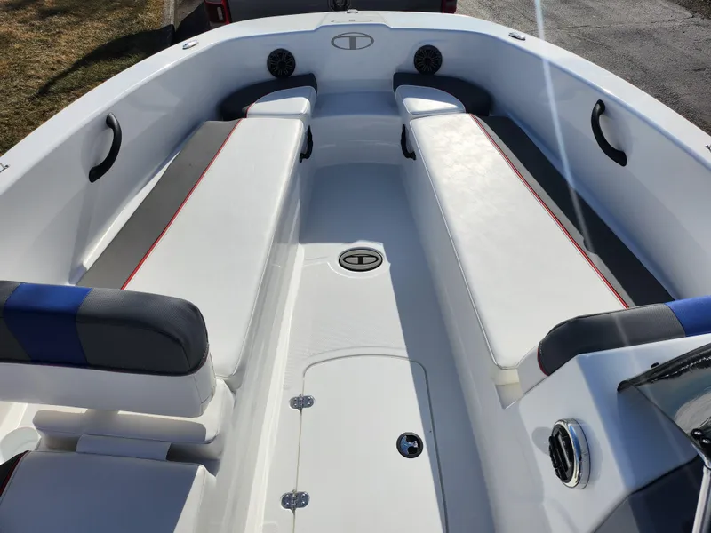 Slide: The Image of 2023 Tahoe T18 boat interior with white seating and modern design. - 14