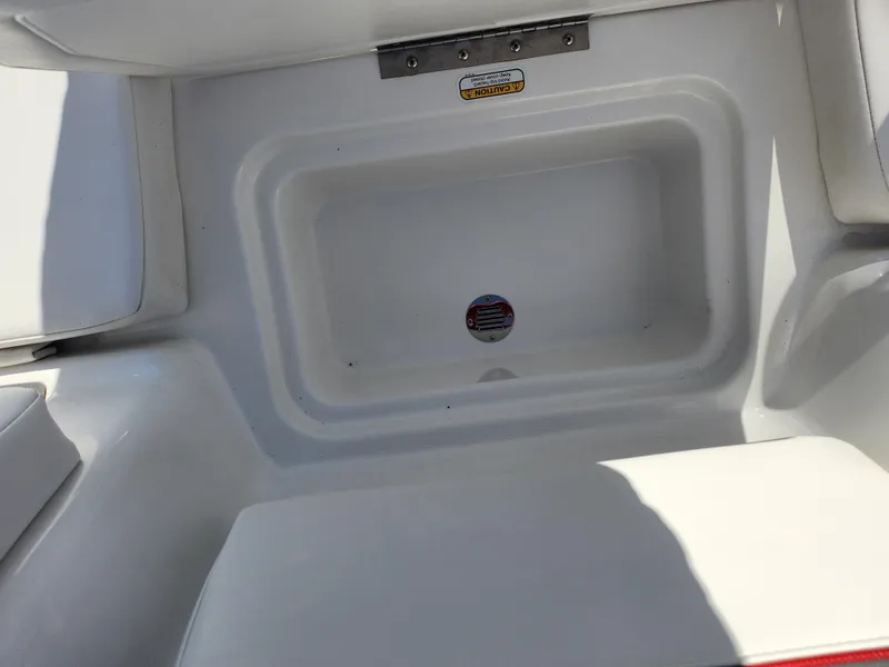 Slide: The Image of 2023 Tahoe T18 boat interior storage compartment, white finish, open lid. - 20