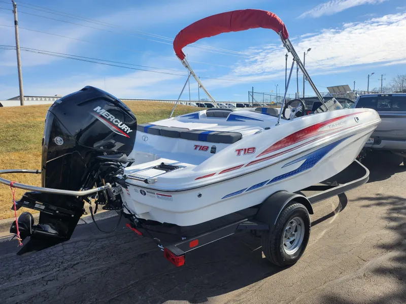 Slide: The Image of 2023 Tahoe T18 boat with Mercury engine on trailer, featuring red and blue accents. - 3