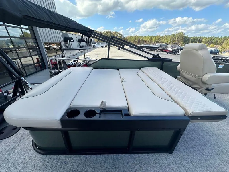 Slide: The Image of 2025 Godfrey Sweetwater 2286 SFLC pontoon boat with white seating and cup holders. - 12