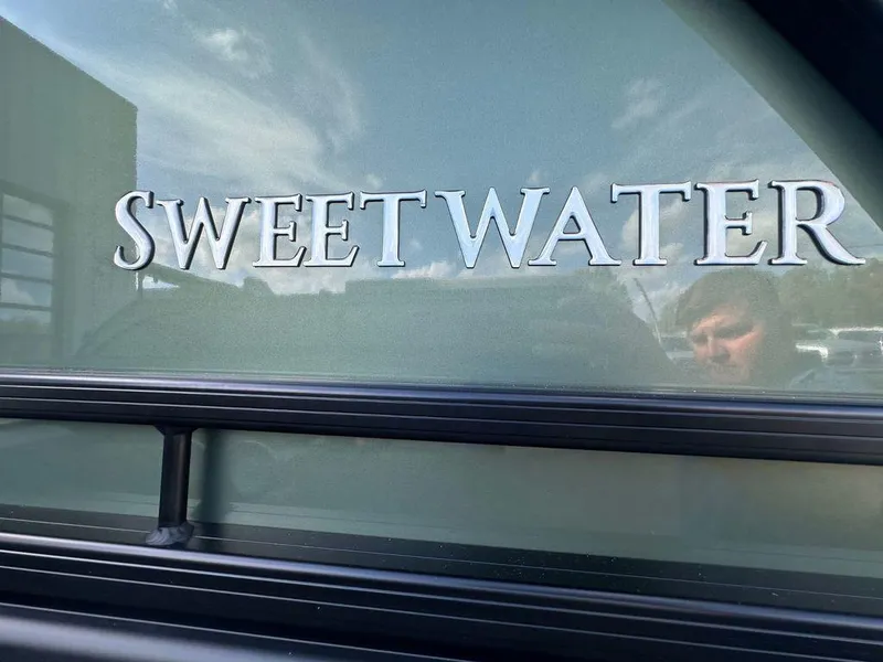 Slide: The Image of 2025 Godfrey Sweetwater 2286 SFLC boat nameplate with reflection. - 14