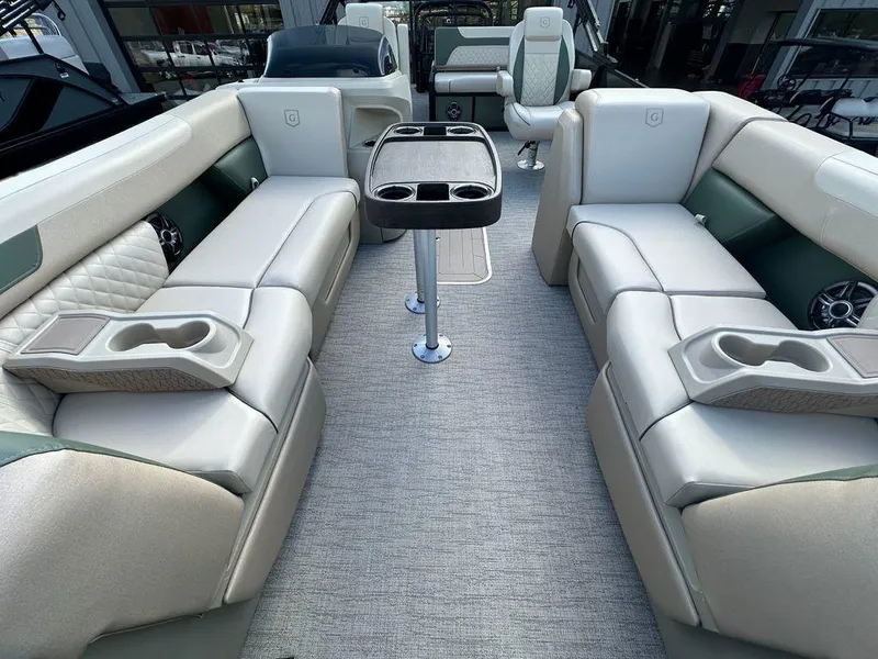 Slide: The Image of Interior of 2025 Godfrey Sweetwater 2286 SFLC pontoon boat with luxurious seating and table. - 7