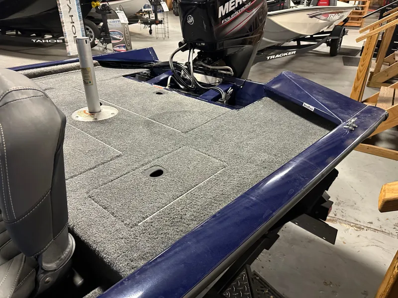 Slide: The Image of 2019 Tracker Pro Team 175 TF boat with carpeted deck and Mercury engine. - 11