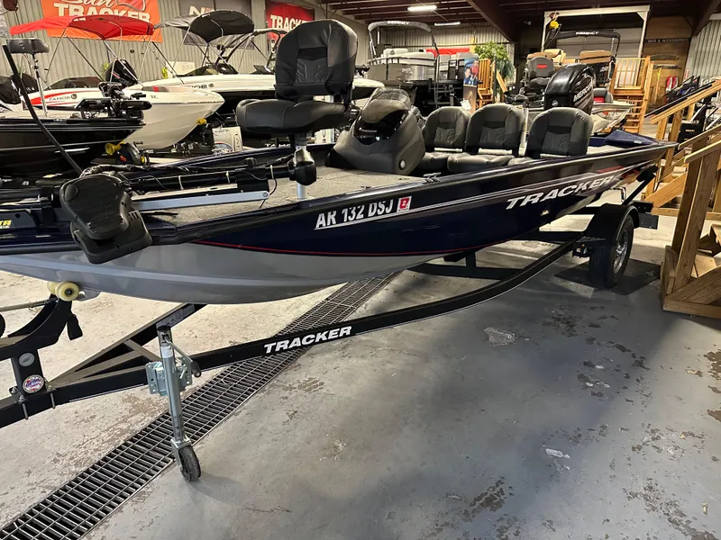 Slide: The Image of 2019 Tracker Pro Team 175 TF fishing boat on trailer in showroom. - 2